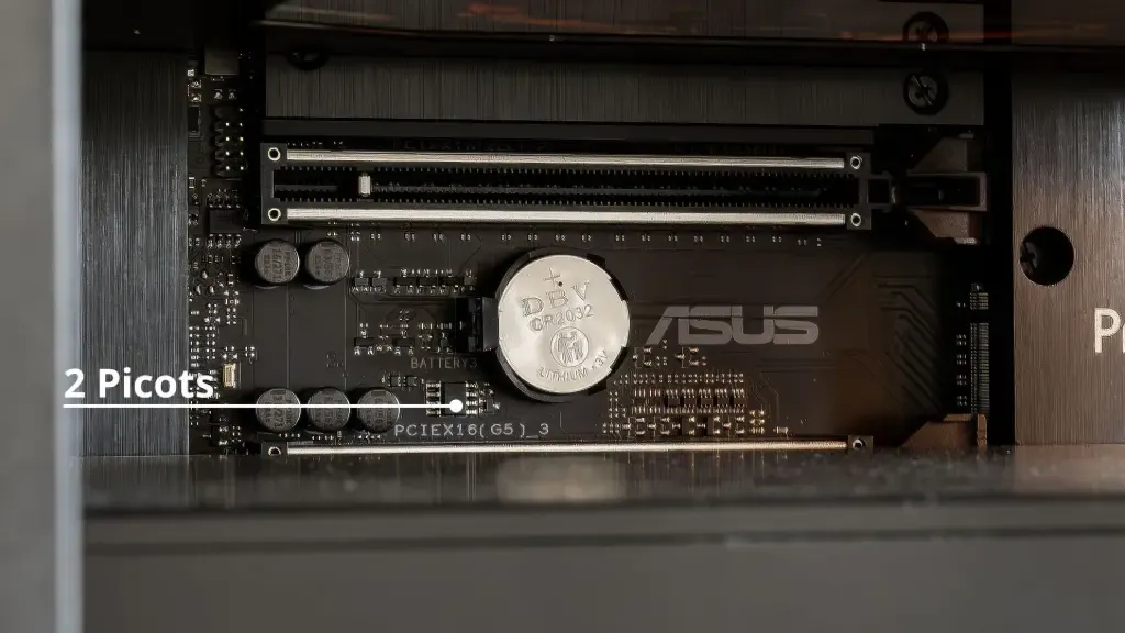The two jumper pins for Clear CMOS next to the battery on an ASUS motherboard