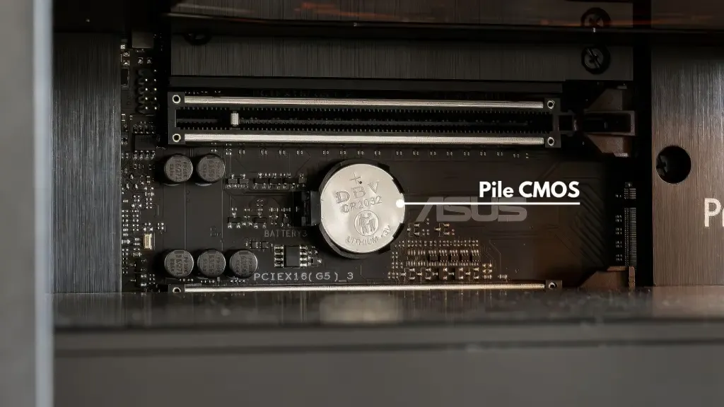 Round CMOS battery installed on an ASUS motherboard