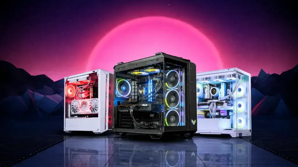 Three black-and-white windowed gaming PCs in front of a neon sunset