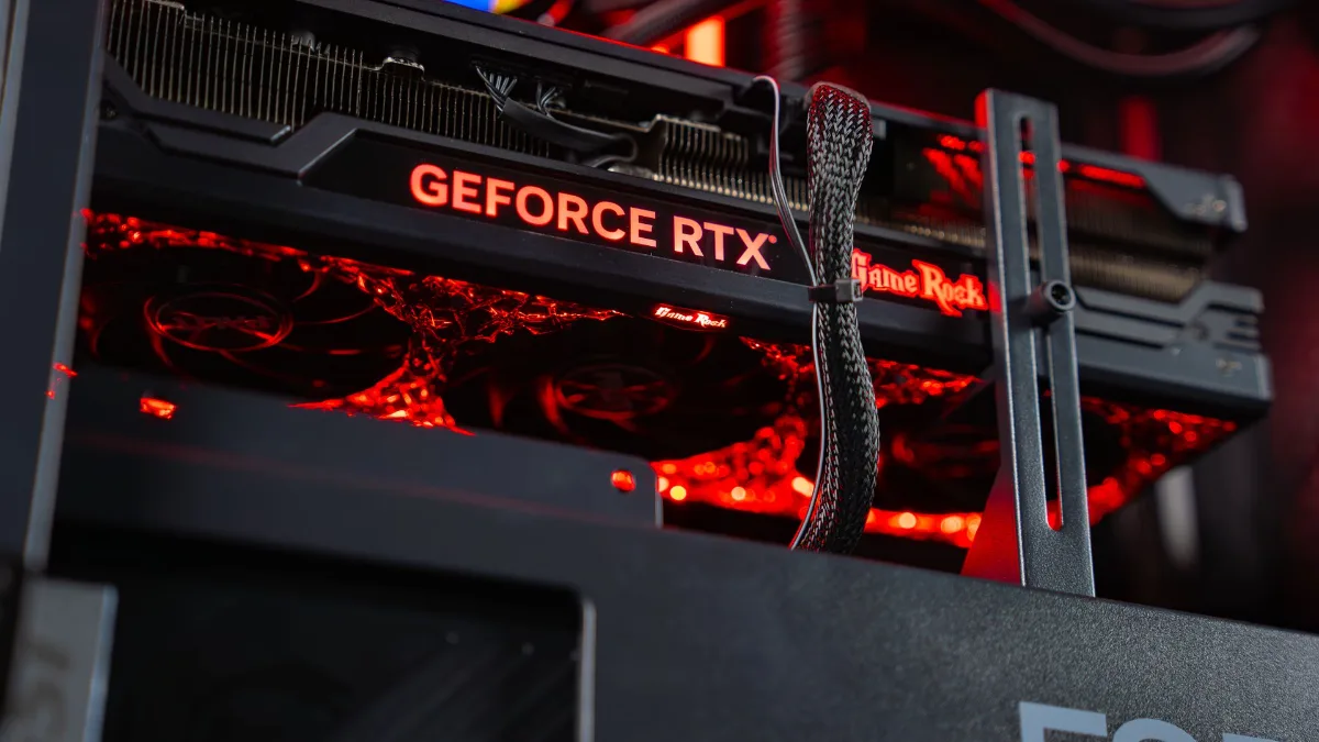 GeForce RTX 4080 graphics card installed in a FlowUP gaming PC with red lighting