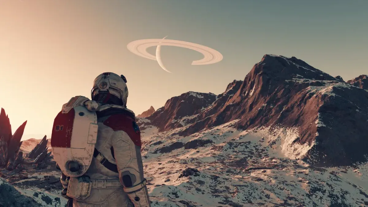 Astronaute sur une planète rocheuse avec une planète à anneaux dans le ciel, dans le jeu Starfield