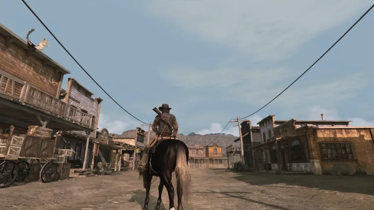 John Marston on horseback in a Western town in Red Dead Redemption on PC