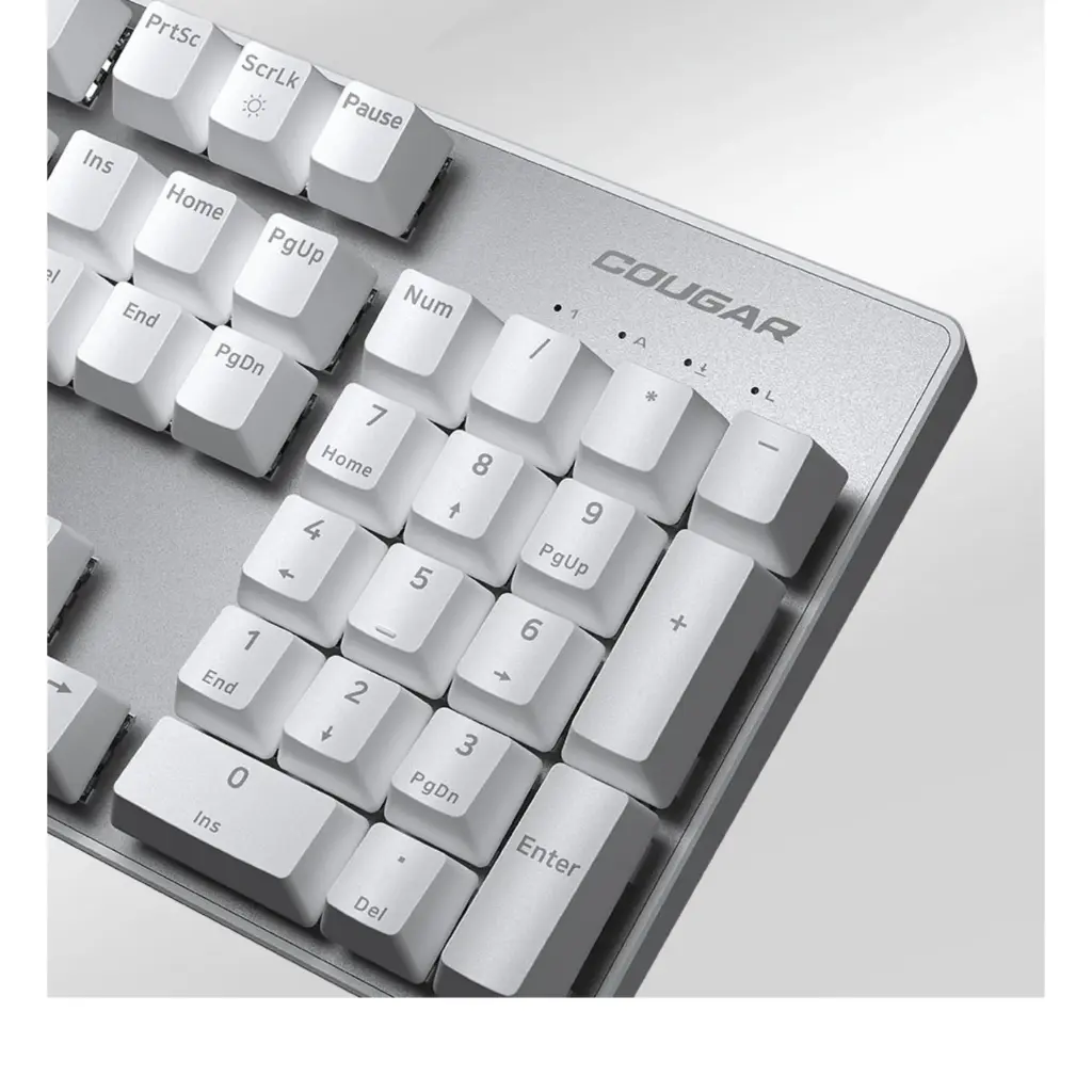 Gros plan sur le pavé numérique d'un clavier mécanique Cougar Ultimus EX blanc avec châssis en acier brossé pour setup gamer FlowUP