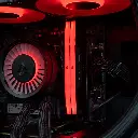 Gros plan sur les deux barrettes de mémoire vive Corsair Vengeance DDR5 rétroéclairées en rouge, installées à côté du waterblock Arctic dans le PC Rift RX 9060 XT
